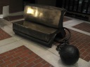 The functional sofa sculpture Book, Ball & Chain by Bill Woodrow.  
What does it mean?  That a good book is impossible to put down, to 
escape? That the books in the British Library are trapped, imprisoned? 
(You can read the books in the library but cannot check any out.)   
Artificially brightened.


